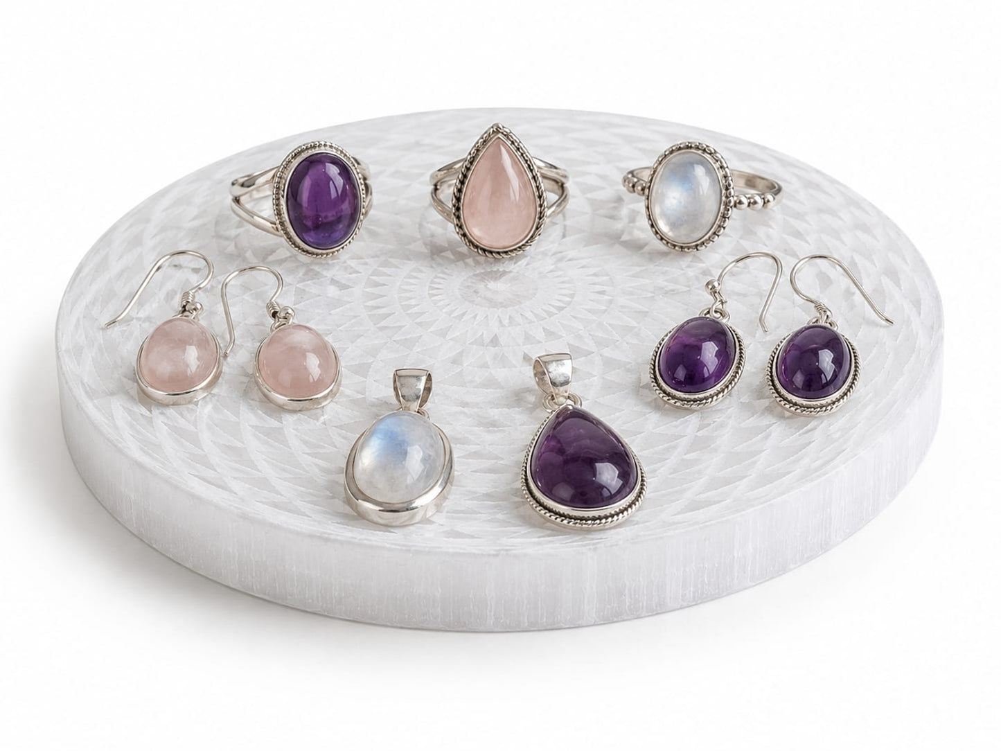 Placa de selenita con joyería de plata 
